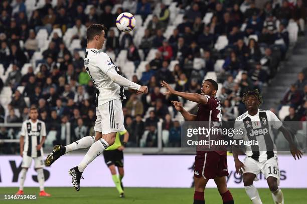 Cristiano Ronaldo of Juventus scores the equalizing goal during the Serie A match between Juventus and Torino FC on May 03, 2019 in Turin, Italy.