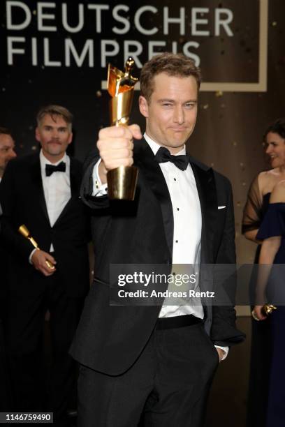 Alexander Fehling, winner best male supporting role, poses during the Lola - German Film Award show at Palais am Funkturm on May 03, 2019 in Berlin,...