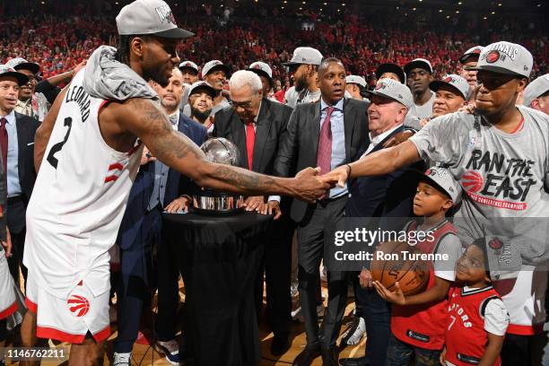 Kawhi Leonard of the Toronto Raptors celebrates with Kyle Lowry after defeating the Milwaukee Bucks during Game Six of the Eastern Conference Finals...