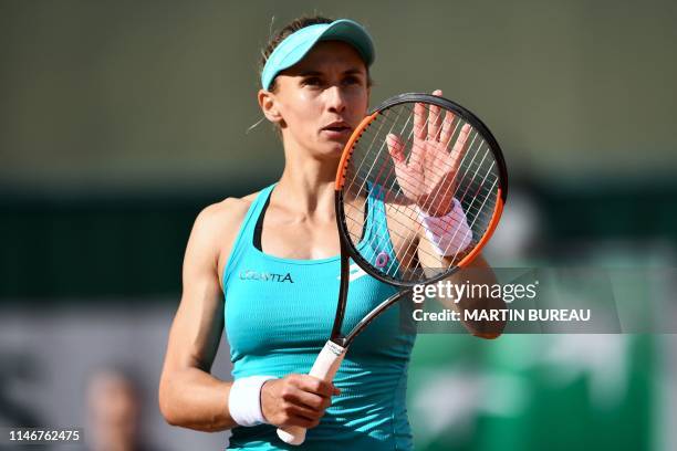 Ukraine's Lesia Tsurenko celebrates after winning against Canada's Eugenie Bouchard during their women's singles first round match on day three of...