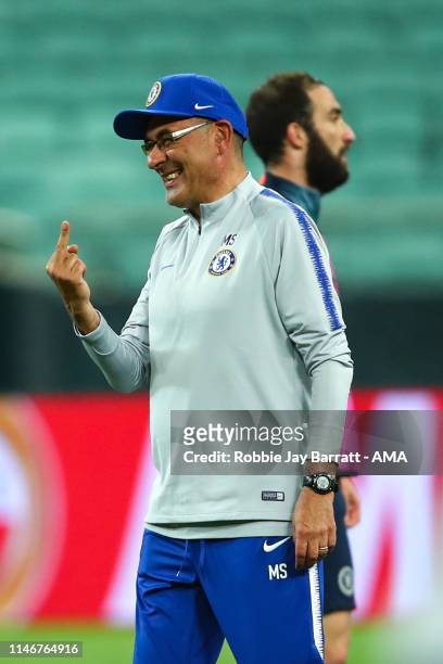 Maurizio Sarri the head coach / manager of Chelsea gestures towards Ross Barkley of Chelsea during the Chelsea training session prior to the UEFA...