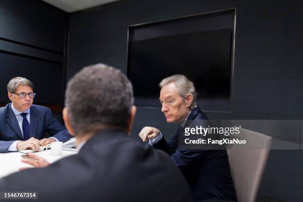 businessman explaining idea in office meeting - shareholder's meeting stock pictures, royalty-free photos & images
