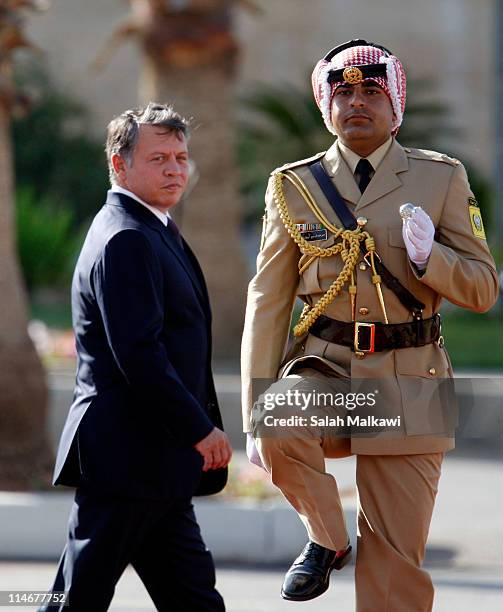 King Abdullah II of Jordan arrives at an official celebration for the 65th anniversary of Independence, on May 25, 2011 in Amman, Jordan. The...