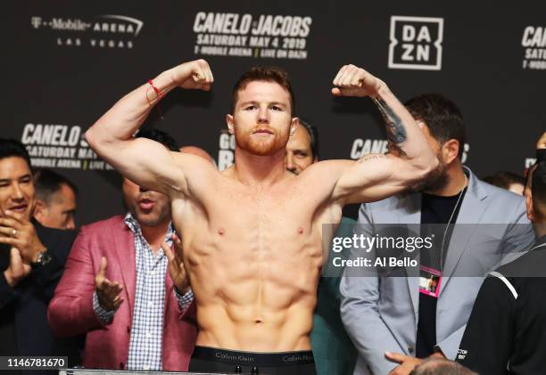 Canelo Alvarez poses on the scale during his official weigh in against Daniel Jacobs at T-Mobile Arena on May 3, 2019 in Las Vegas, Nevada. Alvarez...