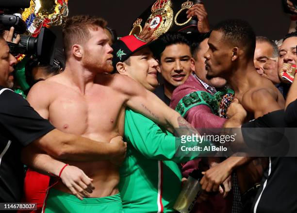 Canelo Alvarez and Daniel Jacobs get into a shoving match during their official weigh in at T-Mobile Arena on May 3, 2019 in Las Vegas, Nevada....