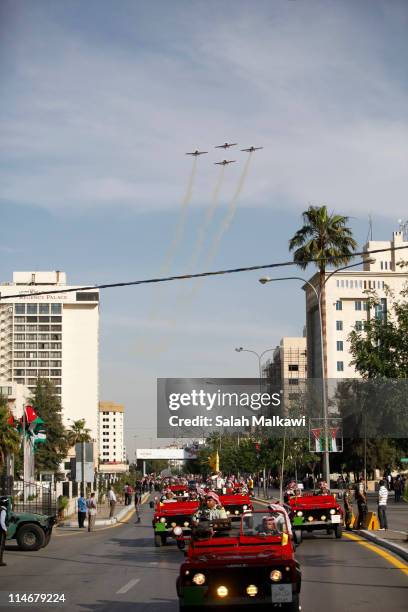 King Abdullah of Jordan arrives in a motorcade for an official celebration for the 65th anniversary of Independence on May 25, 2011 in Amman, Jordan....