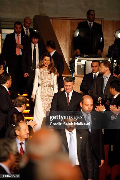 King Abdullah of Jordan, his wife Queen Rania of Jordan and their son Crown Prince Hussein arrive at an official celebration for the 65th anniversary...