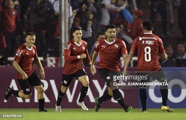 Argentina's Independiente forward Silvio Romero celebrates with teammates after scoring a goal against Colombia's Rionegro Aguilas during theCopa...