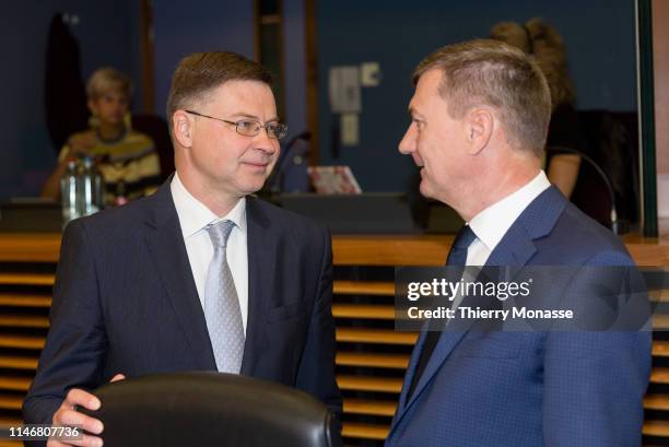 Euro & Social Dialogue Commissioner Valdis Dombrovskis is talking with the EU Digital Single Market Commissioner Andrus Ansip prior the weekly...