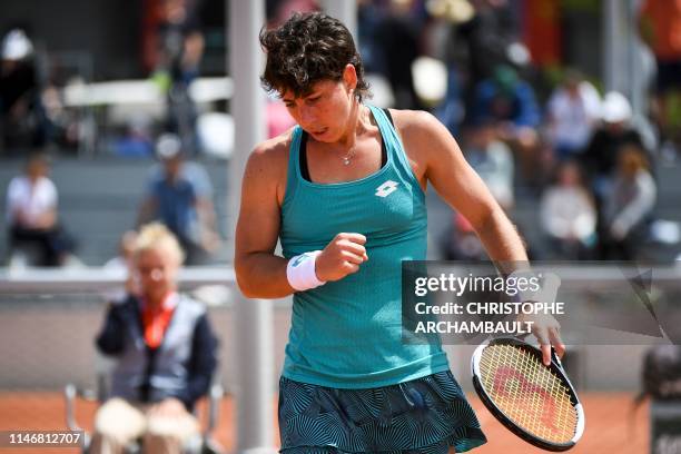 Spain's Carla Suarez Navarro reacts as she plays against Shelby Rogers of the US during their women's singles second round match on day four of The...