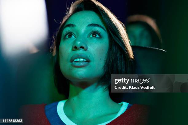 shocked woman at movie theater - cinema stock pictures, royalty-free photos & images