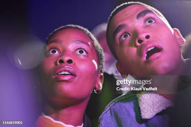 shocked friends in movie theater - woman watching horror movie stock pictures, royalty-free photos & images