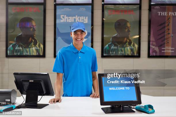 portrait of smiling cashier at theater - ticket counter stock pictures, royalty-free photos & images