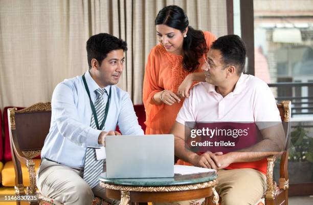 financial advisor with indian family - human role stock pictures, royalty-free photos & images