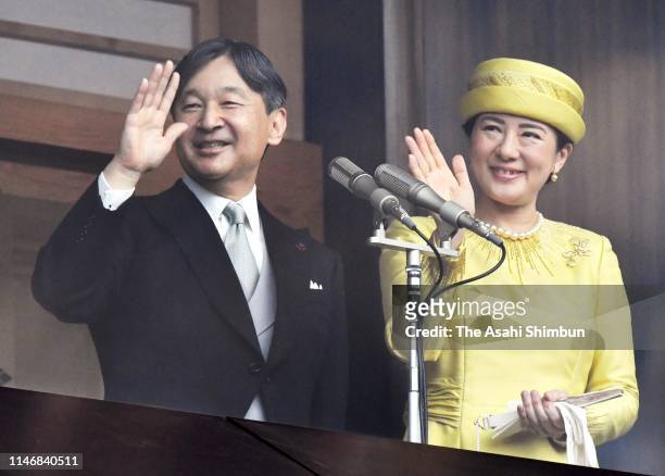 Emperor Naruhito and Empress Masako wave to well-wishers after making a public speech on the balcony of the Imperial Palace on May 4, 2019 in Tokyo,...