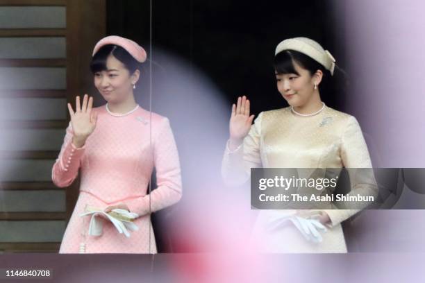 Princess Mako and Princess Kako of Akishino wave to members of the public after making a public speech on the balcony of the Imperial Palace on May...