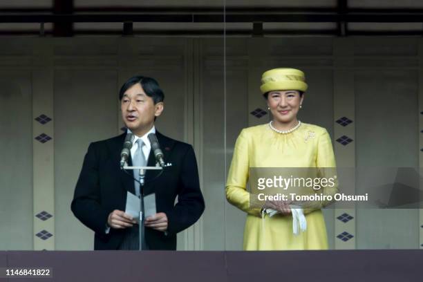 Japan's Emperor Naruhito addresses as Empress Masako looks on from the balcony of the Imperial Palace on May 04, 2019 in Tokyo, Japan. Emperor...