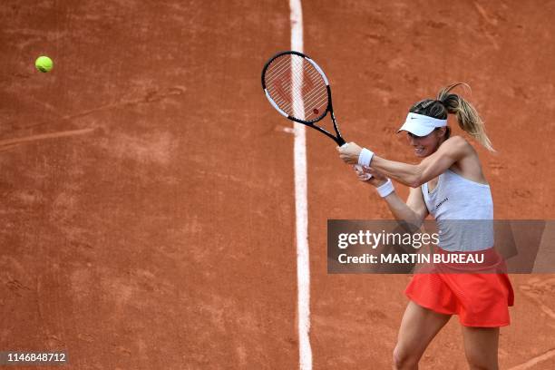 Luxembourg's Mandy Minella returns the ball to Latvia's Anastasija Sevastova during their women's singles second round match on day four of The...