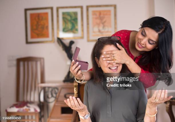 surprise for mother - indian mother daughter stock pictures, royalty-free photos & images