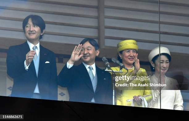 Crown Prince Akishino, Emperor Naruhito, Empress Masako and Crown Princess Kiko of Akishino wave to members of the public after making a public...