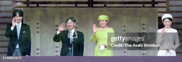 Crown Prince Akishino, Emperor Naruhito, Empress Masako and Crown Princess Kiko of Akishino wave to members of the public after making a public...