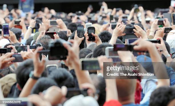 Well-wishers take photographs with royal family at the Imperial Palace on May 4, 2019 in Tokyo, Japan.