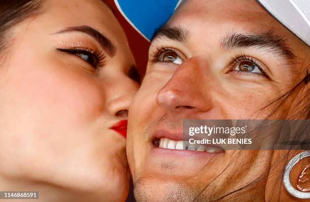 Team AG2R La Mondiale rider France's Nans Peters celebrates his victory during the podium ceremony after the stage seventeen of the 102nd Giro...