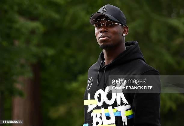 France's midfielder Paul Pogba arrives at the French national football team training base in Clairefontaine-en-Yvelines on May 29, 2019 as part of...