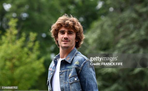 France's forward Antoine Griezmann arrives at the French national football team training base in Clairefontaine-en-Yvelines on May 29, 2019 as part...