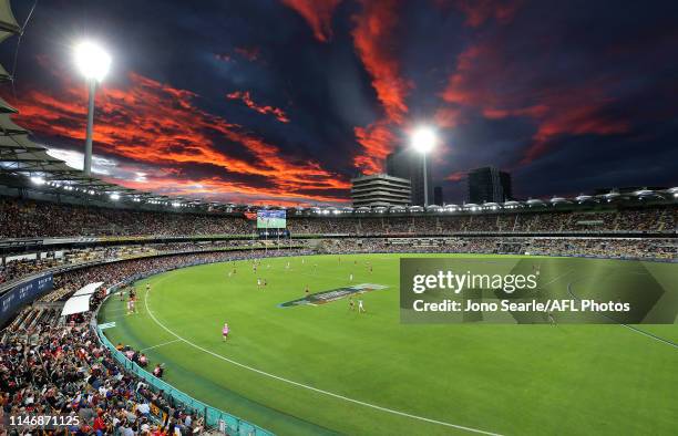 General view and sunset during the round seven AFL match between the Brisbane Lions and the Sydney Swans at The Gabba on May 04, 2019 in Brisbane,...