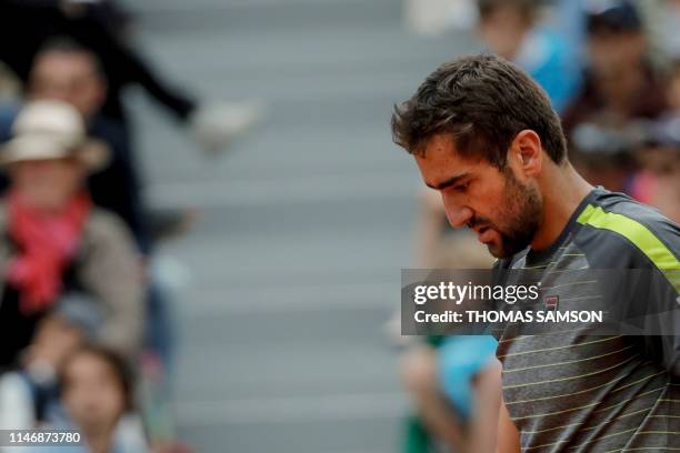 Croatia's Marin Cilic reacts during his men's singles second round match against Bulgaria's Grigor Dimitrov on day four of The Roland Garros 2019...