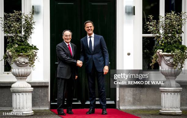 Dutch Prime Minister Mark Rutte shakes hands with Chinese vice-president Wang Qishan at the Catshuis for a meeting and a work diner, dedicated to the...