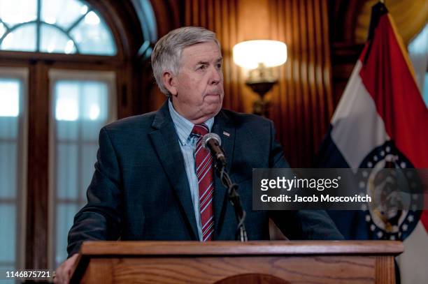 Gov. Mike Parson listens to a media question during a press conference to discuss the status of license renewal for the St. Louis Planned Parenthood...