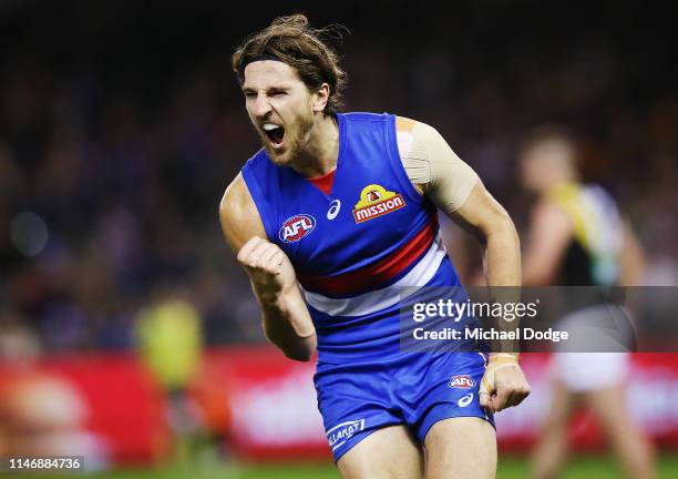 Marcus Bontempelli of the Bulldogs celebrates a goal during the round seven AFL match between the Western Bulldogs and the Richmond Tigers at Marvel...