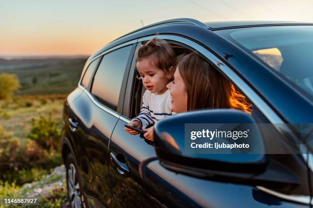 photo of son and his mother on the road trip - small family stock pictures, royalty-free photos & images