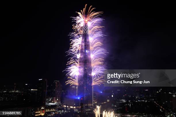 Fireworks illuminate on the Lotte World Tower to wish for peace and shared prosperity in the Korean peninsula under the title of "Go. Together !" on...