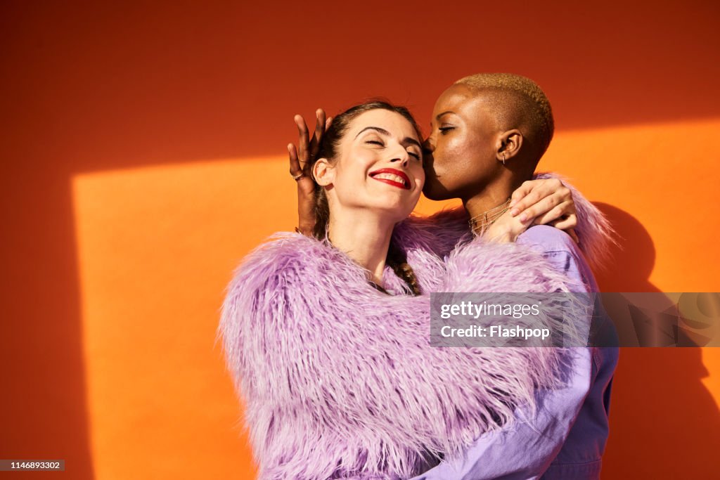 Colourful studio portrait of two women