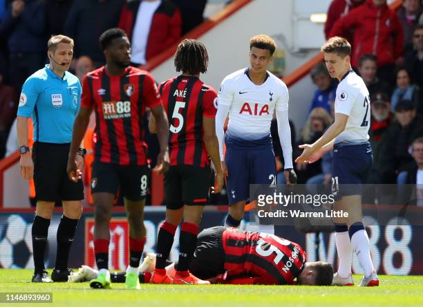 Jack Simpson of AFC Bournemouth goes to ground after being fouled by Juan Foyth of Tottenham Hotspur, a foul referee Craig Pawson awards Juan Foyth...