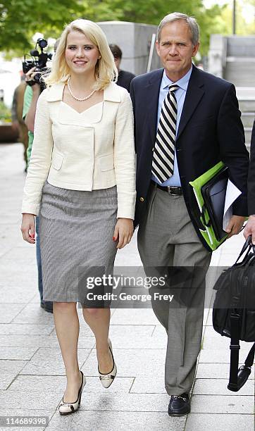 Elizabeth Smart walks out of federal court with her father Ed Smart after a hearing for the sentencing of her kidnapper Brian David Mitchell May 25,...