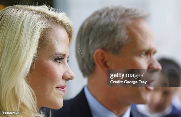 Elizabeth Smart listens to her father Ed Smart talk to the press after a hearing for the sentencing of her kidnapper Brian David Mitchell May 25,...