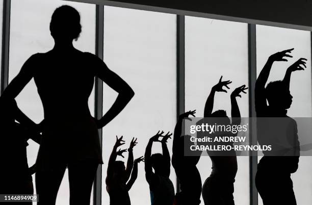 Dancers from the Dance Theatre of Harlem and the Collage Dance Collective rehearse during a preview for the media of the REACH, an expansion project,...
