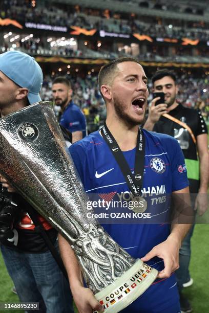 Chelsea's Belgian midfielder Eden Hazard celebrates with the trophy after winning the UEFA Europa League final football match between Chelsea FC and...