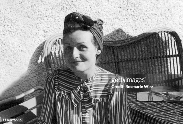 young woman sitting on balcony, switzerland 1944 - 1944 stock pictures, royalty-free photos & images