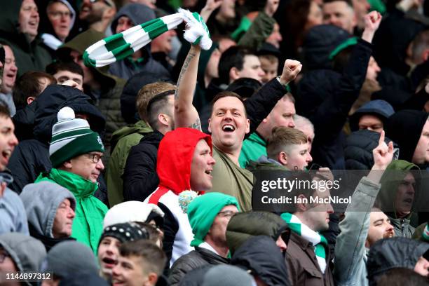 Celtic fans celebrate during the Ladbrokes Scottish Premiership match between Aberdeen and Celtic at Pittodrie Stadium on May 04, 2019 in Aberdeen,...