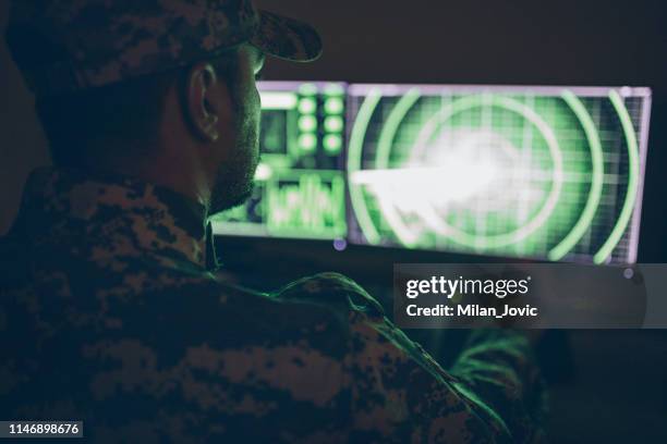 american soldier in headquarter control center - military intelligence stock pictures, royalty-free photos & images