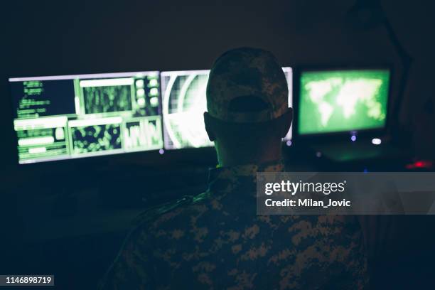 american soldier in headquarter control center - military intelligence stock pictures, royalty-free photos & images