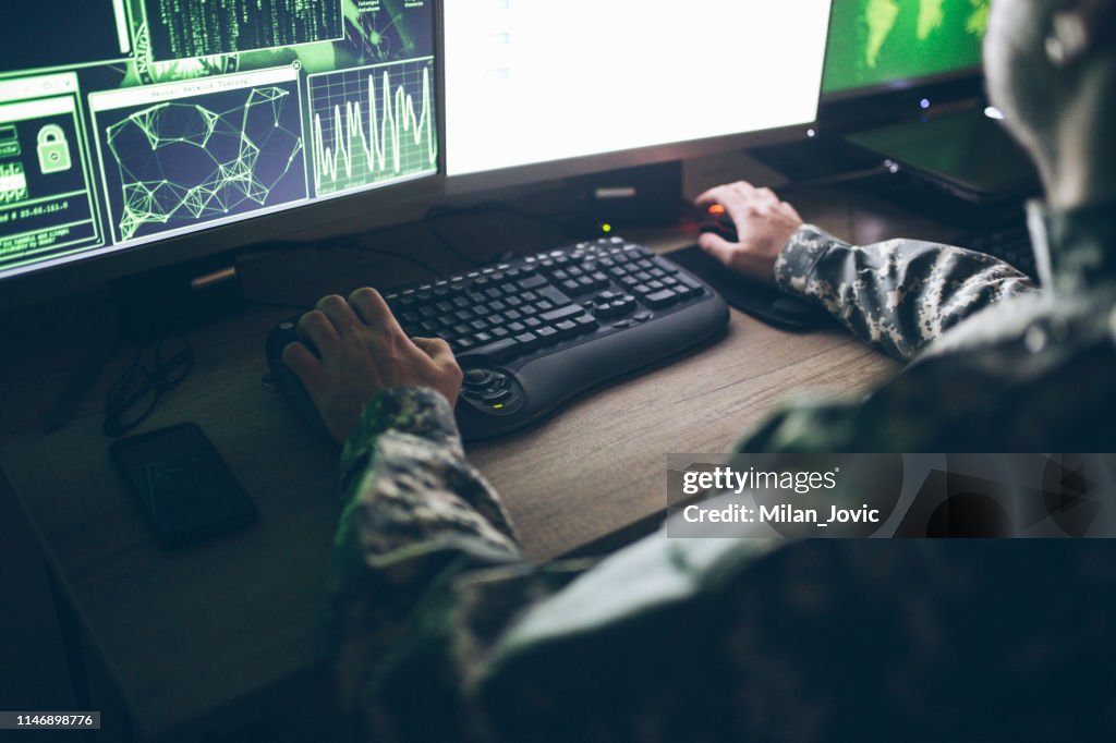 American soldier in headquarter control center