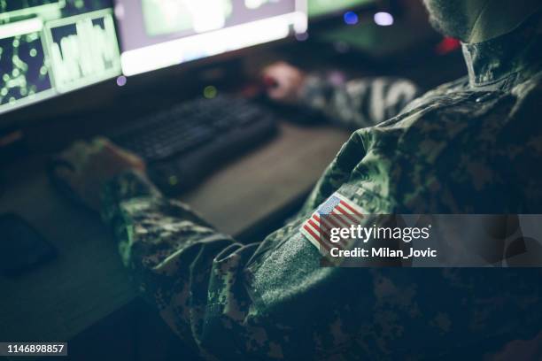 american soldier in headquarter control center - military intelligence stock pictures, royalty-free photos & images