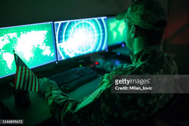 american soldier in headquarter control center - army stock pictures, royalty-free photos & images