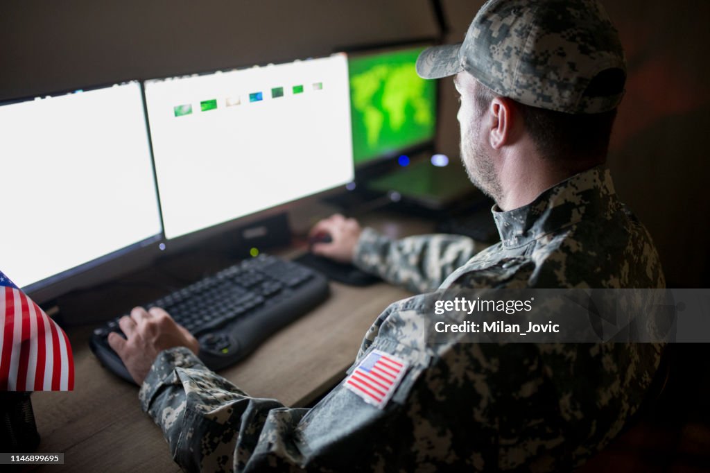 American soldier in headquarter control center